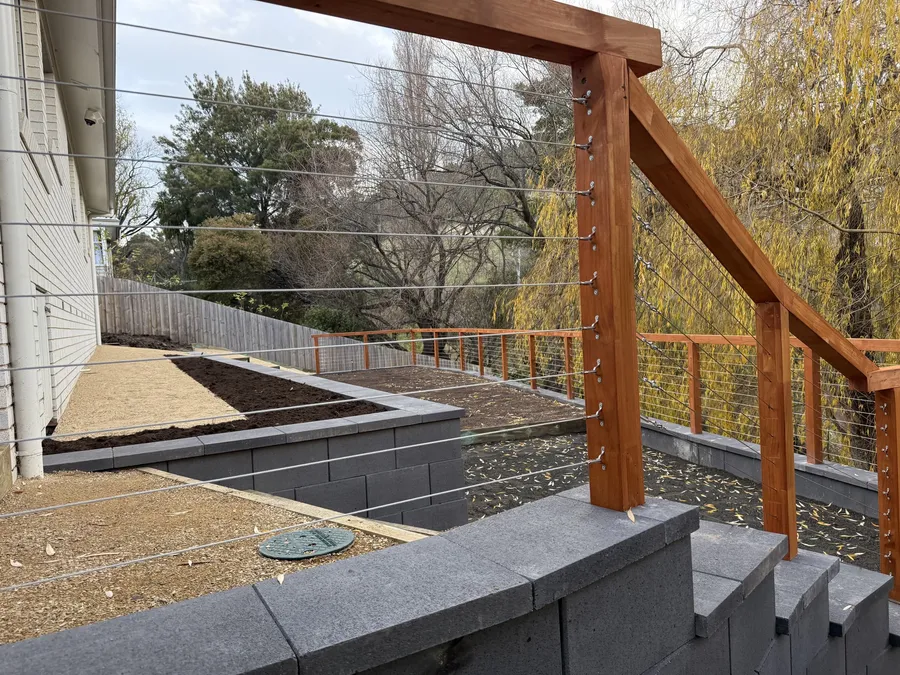 Block steps with timber posts and stainless cable wire balustrade
