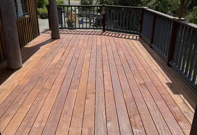 New hardwood deck boards running out to a balustrade with bushland beyond