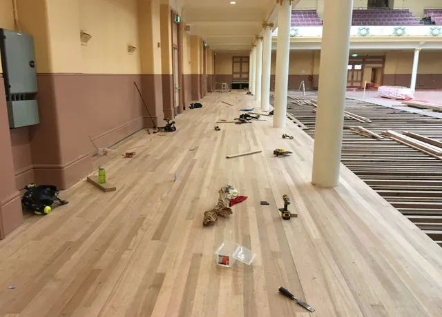 New timber floor being installed in a heritage building