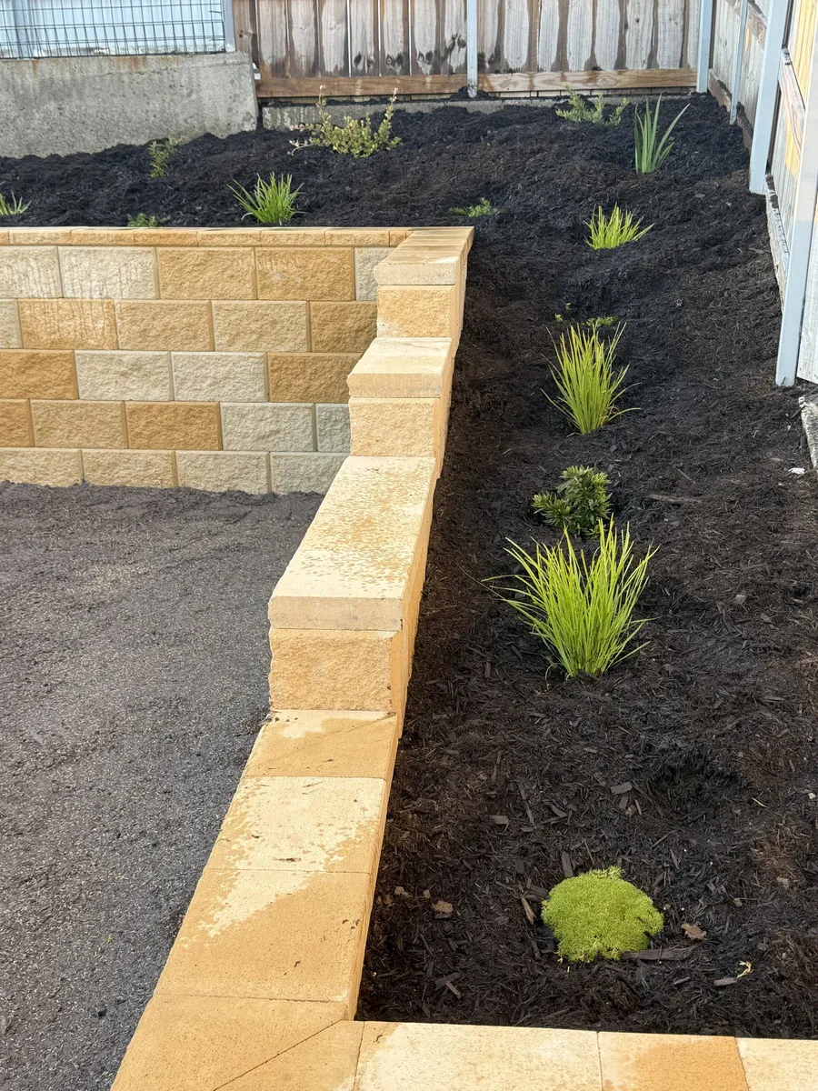 After: stepped sandstone capping detail at the wall corner